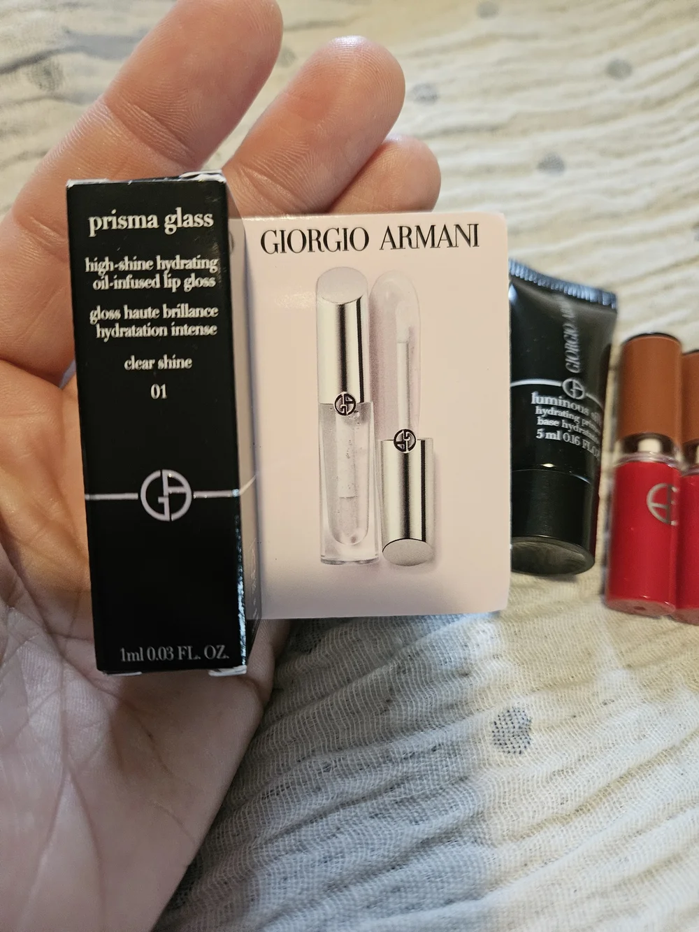 4 Giorgio Armani;  2 Lip in Venetian Red, gloss and primer.